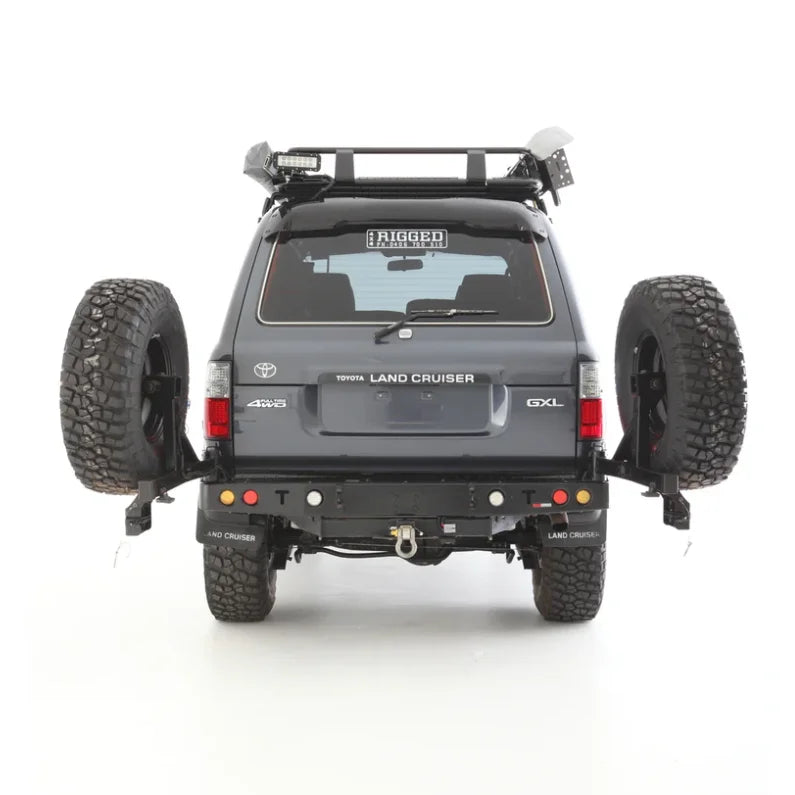 Gray Toyota Land Cruiser with dual spare wheels and Rockarmor steel wheel carrier
