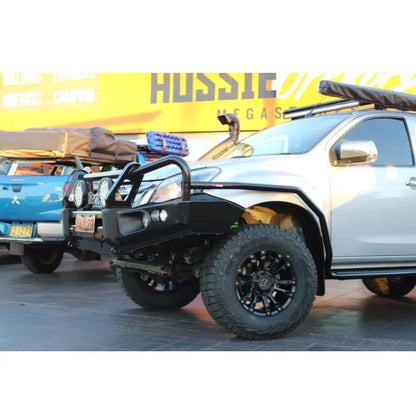 Silver off-road Isuzu Mux 2013-2017 with Rockarmor Elite Hoop bull bar featuring integrated fog lights