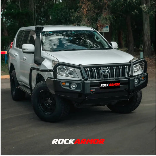 Silver off-road vehicle with black accessories featuring the Rockarmor Elite Steel Bullbar for Toyota Prado 150 2009-2013