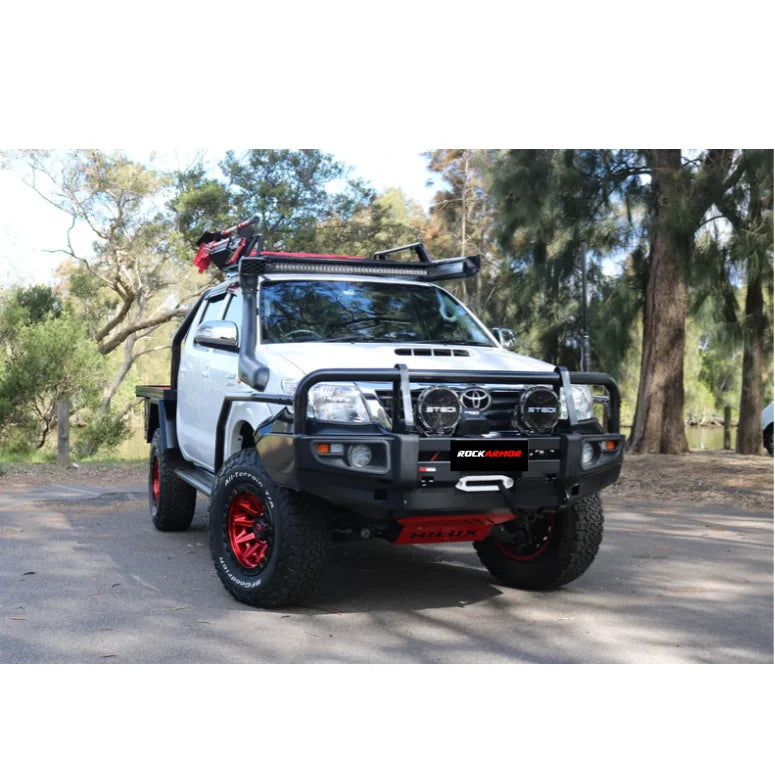 White off-road pickup truck equipped with rockarmor premium steel bull bar for toyota hilux n70 2005 to 2011 bumper cut