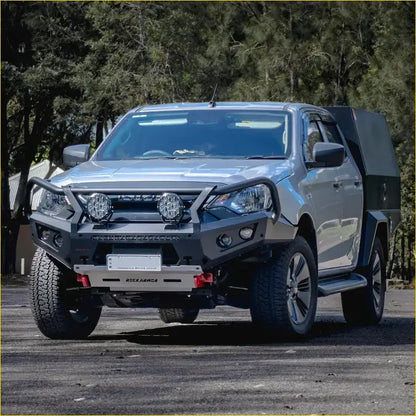 Silver isuzu dmax 2024 pickup with black gt hoop bullbar and rock sliders from rockarmor rock pack on rugged tires