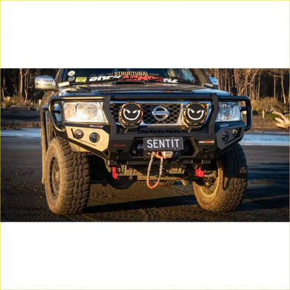 Black rugged rockarmor rock pack front bumper with smiling circular headlights and nissan emblem for patrol gu4+