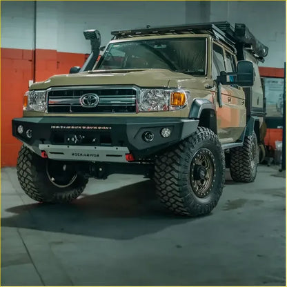 Tan toyota land cruiser with black rockarmor front bumper rugged off-road tires part of rockarmor rock pack 2007-2023